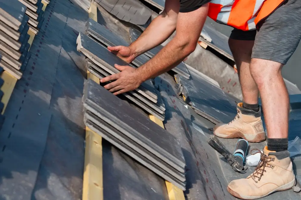 Tile roof being repaired in Albuquerque by A Honorable Roofing Company