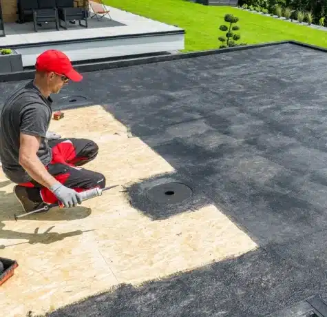 Modified bitumen flat roof detail showing layered protection system