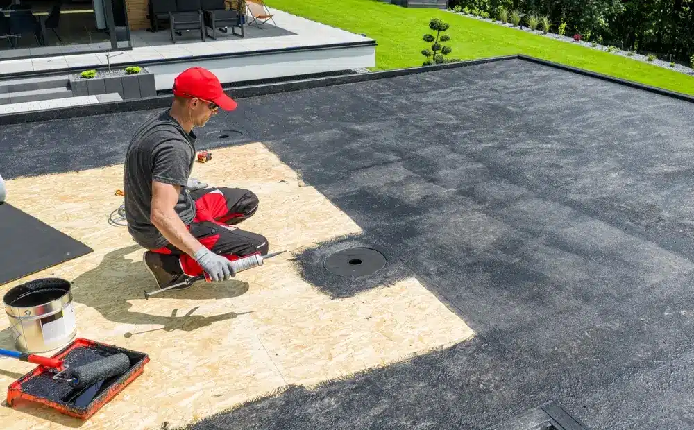 Modified bitumen flat roof detail showing layered protection system