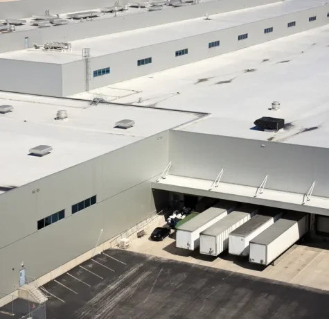 Professional commercial roofing contractor inspecting a flat roof in Albuquerque, NM