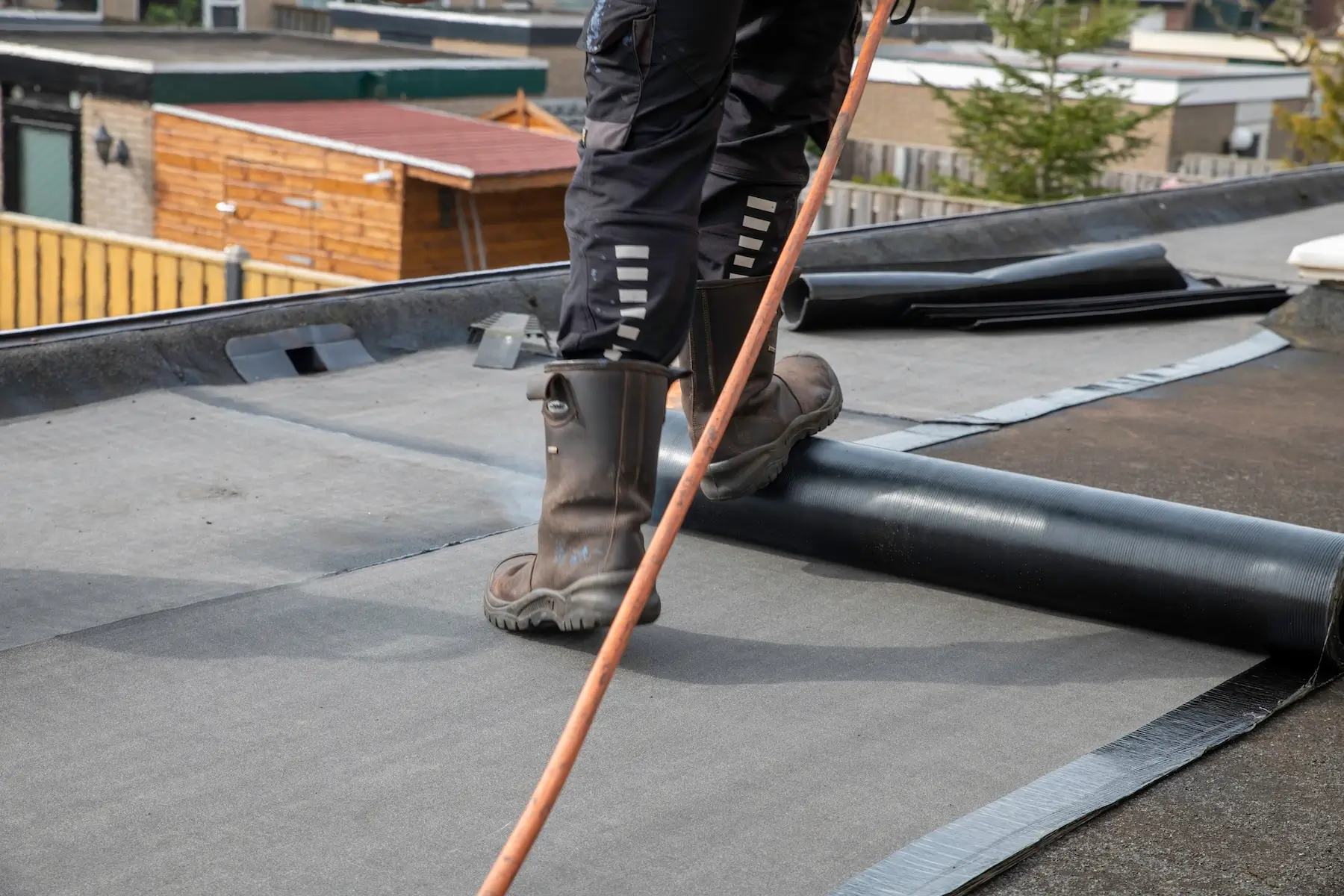 Flat roof repair contractor working on a roof in Los Lunas, NM